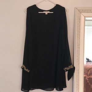 Cold shoulder mini dress with gold floral cuffs